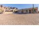 Southwest style home with a large driveway and mountain backdrop at 3498 N Morningside Rd, Apache Junction, AZ 85119