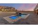 Serene pool and spa area with a rock waterfall and mountain backdrop at 3498 N Morningside Rd, Apache Junction, AZ 85119