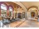 Dining room with arched windows and doorways leading to other areas of the home at 6105 E Sage Dr, Paradise Valley, AZ 85253