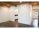 Simple bedroom with wood beam ceilings and polished concrete floors at 6237 E Pinchot Ave, Scottsdale, AZ 85251