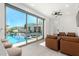 Relaxing room with sliding doors leading to a sparkling pool at 30927 N 117Th Dr, Peoria, AZ 85383