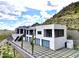 Contemporary home with a large driveway and desert landscaping at 4880 E Lone Mountain N Rd, Cave Creek, AZ 85331