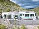 Luxury home nestled on a hillside with a private pool and stunning mountain backdrop at 4880 E Lone Mountain N Rd, Cave Creek, AZ 85331