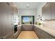 Modern outdoor kitchen with mountain views and built-in appliances at 4880 E Lone Mountain N Rd, Cave Creek, AZ 85331