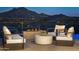 Modern patio furniture with fire pit and mountain views at 4880 E Lone Mountain N Rd, Cave Creek, AZ 85331