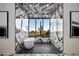 Bathroom features marble walls, a soaking tub, and a walk-in shower with mountain views at 4880 E Lone Mountain N Rd, Cave Creek, AZ 85331