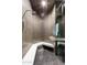 Spa-like shower with pebble floor and built-in bench at 4880 E Lone Mountain N Rd, Cave Creek, AZ 85331