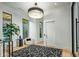 Elegant entryway with a stunning chandelier and modern decor at 4880 E Lone Mountain N Rd, Cave Creek, AZ 85331