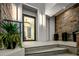Modern home exterior with stone accents and a sleek glass entryway at 4880 E Lone Mountain N Rd, Cave Creek, AZ 85331