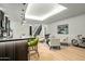 Basement game room with wet bar, seating area, and stylish decor at 4880 E Lone Mountain N Rd, Cave Creek, AZ 85331