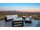 Modern patio furniture with fire pit and mountain views at 4880 E Lone Mountain N Rd, Cave Creek, AZ 85331