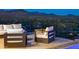 Modern patio furniture with fire pit and mountain views at 4880 E Lone Mountain N Rd, Cave Creek, AZ 85331