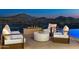 Modern patio furniture with fire pit and mountain views at 4880 E Lone Mountain N Rd, Cave Creek, AZ 85331
