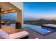 Infinity pool with panoramic views of the desert landscape at dusk at 4880 E Lone Mountain N Rd, Cave Creek, AZ 85331
