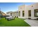Landscaped backyard with artificial turf and modern seating at 4880 E Lone Mountain N Rd, Cave Creek, AZ 85331