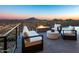 Modern patio furniture with fire pit and mountain views at 4880 E Lone Mountain N Rd, Cave Creek, AZ 85331