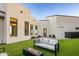 Artificial turf backyard with fire pit and modern seating at 4880 E Lone Mountain N Rd, Cave Creek, AZ 85331