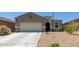 Single-story home with front yard landscaping and driveway at 3660 N 310Th Ln, Buckeye, AZ 85396