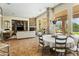 Bright dining area with stone fireplace and access to backyard at 7377 E Alta Sierra Dr, Scottsdale, AZ 85266