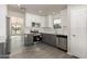 Renovated kitchen with gray cabinets and quartz counters at 7526 W Sweetwater Ave, Peoria, AZ 85381