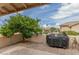 Covered patio with grill and lush landscaping, perfect for BBQs at 7930 E Pueblo Ave # 63, Mesa, AZ 85208