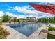 Inviting swimming pool with surrounding patio and lounge chairs at 10553 E Relativity Ave, Mesa, AZ 85212