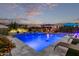 Stunning pool with built-in seating and colorful lighting at 10553 E Relativity Ave, Mesa, AZ 85212