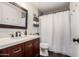 Clean bathroom with a vanity and shower/tub combo at 1201 E Le Marche Ave, Phoenix, AZ 85022