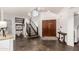 Spacious entryway with tiled floors, staircase, and coat rack at 1201 E Le Marche Ave, Phoenix, AZ 85022