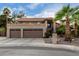 Two-story house with a three-car garage and desert landscaping at 1201 E Le Marche Ave, Phoenix, AZ 85022