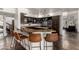 Modern kitchen featuring granite countertops and dark wood cabinetry at 1201 E Le Marche Ave, Phoenix, AZ 85022