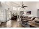 Open living room with a fireplace, large windows, and comfortable seating at 1201 E Le Marche Ave, Phoenix, AZ 85022