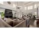 Spacious living room with a high ceiling, fireplace, and lots of natural light at 1201 E Le Marche Ave, Phoenix, AZ 85022