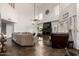 Bright living room with vaulted ceiling, fireplace, and large windows at 1201 E Le Marche Ave, Phoenix, AZ 85022