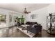 Bright living room with tiled floors, comfy seating, and large windows at 1201 E Le Marche Ave, Phoenix, AZ 85022