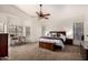 Spacious main bedroom with carpeted floors and ceiling fan at 1201 E Le Marche Ave, Phoenix, AZ 85022
