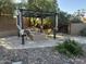Charming patio with pergola, fire pit, and comfortable seating area at 1201 E Le Marche Ave, Phoenix, AZ 85022