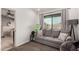 Cozy sitting area with a sofa and access to a bathroom at 1201 E Le Marche Ave, Phoenix, AZ 85022