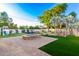 Large backyard with play structure, fire pit, and water features at 2346 E Sanoque Ct, Gilbert, AZ 85298