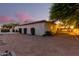 Spacious backyard with a putting green, landscaped lawn, and modern lighting at 2346 E Sanoque Ct, Gilbert, AZ 85298
