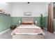 Serene bedroom with a double bed and green accent wall at 2346 E Sanoque Ct, Gilbert, AZ 85298