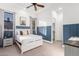 Bedroom with blue-gray wall paneling, white bed, and built-in closet at 2346 E Sanoque Ct, Gilbert, AZ 85298