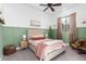 Charming bedroom with a double bed and green accent wall at 2346 E Sanoque Ct, Gilbert, AZ 85298