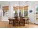 Dining room with wooden table and backyard views at 2346 E Sanoque Ct, Gilbert, AZ 85298