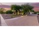 Brick driveway leading to a stunning home at sunset at 2346 E Sanoque Ct, Gilbert, AZ 85298