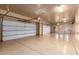 Large garage with two garage doors and extra storage at 2346 E Sanoque Ct, Gilbert, AZ 85298