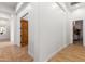 Long hallway with wood-look tile flooring at 2346 E Sanoque Ct, Gilbert, AZ 85298