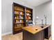 Home office features built-in bookshelves and a large desk at 2346 E Sanoque Ct, Gilbert, AZ 85298
