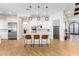 Spacious kitchen with island, stainless steel appliances, and white cabinets at 2346 E Sanoque Ct, Gilbert, AZ 85298