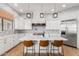 Modern kitchen with white cabinets and large island at 2346 E Sanoque Ct, Gilbert, AZ 85298
